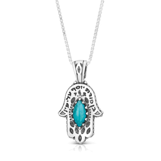 A silver Hamsa pendant with a turquoise stone.