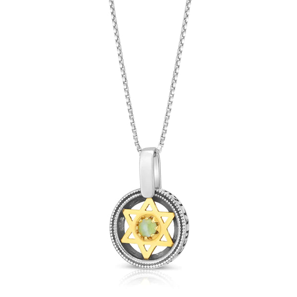 A silver pendant with a gold Star of David embedded with a cat's eye stone.