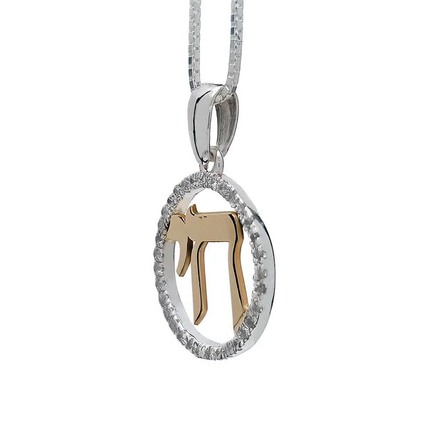 A silver pendant with the word "Chai" (meaning "life" in Hebrew), combined with gold and adorned with cubic zirconia.