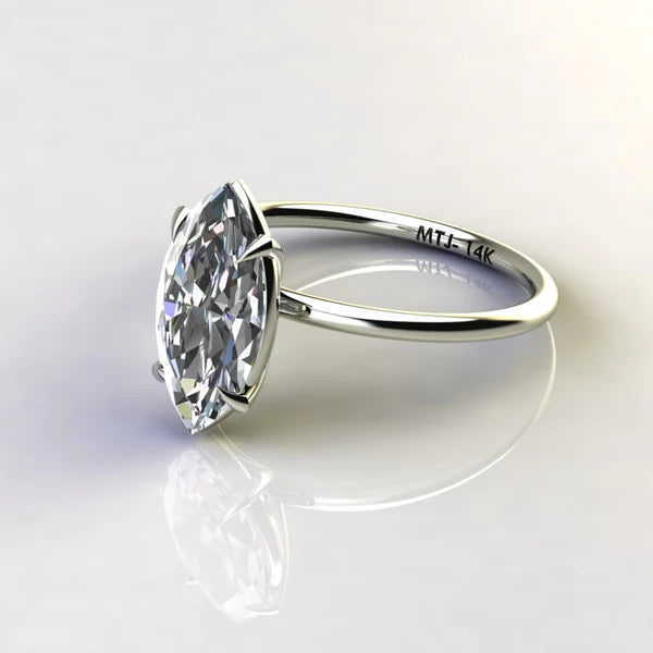 A 14K gold engagement ring with a marquise-cut stone measuring 2 carats.