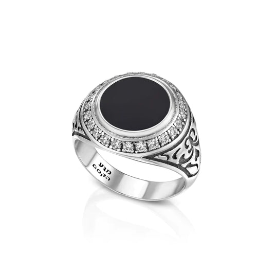 A round signet ring made of sterling silver, adorned with onyx gemstone accents.