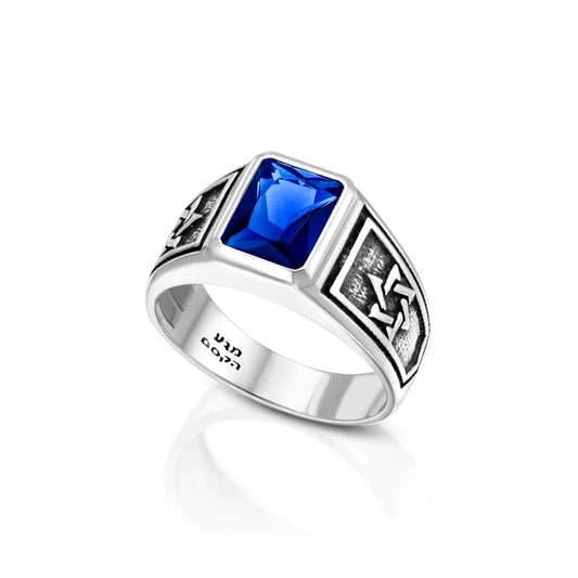 A men's silver ring adorned with royal blue cubic zirconia.