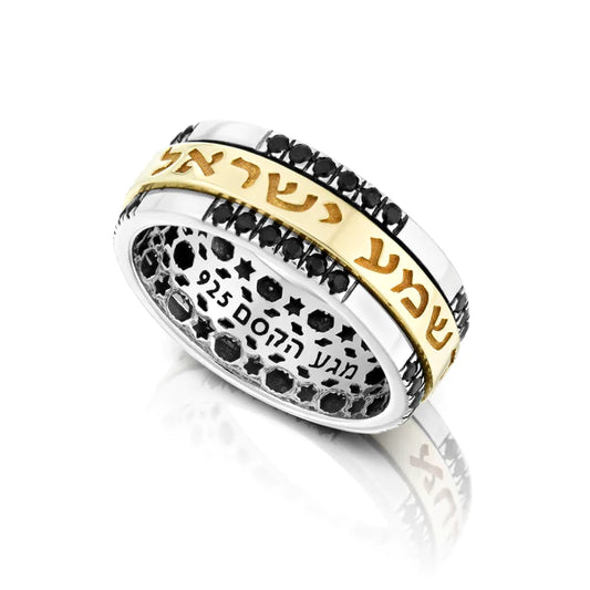 A spinning ring with onyx gemstones, made of silver and gold, featuring the inscription "Shema Yisrael."