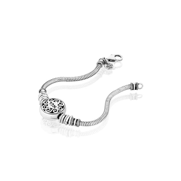 A silver bracelet with an adorned head featuring the combination of the initials A.L.D.