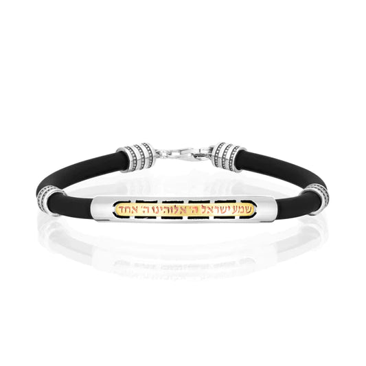 A silicone bracelet with "Shema Yisrael" inscription, made of silver with gold accents.