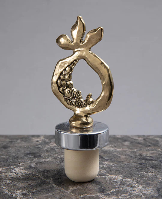 Bronze-coated pomegranate wine stopper.