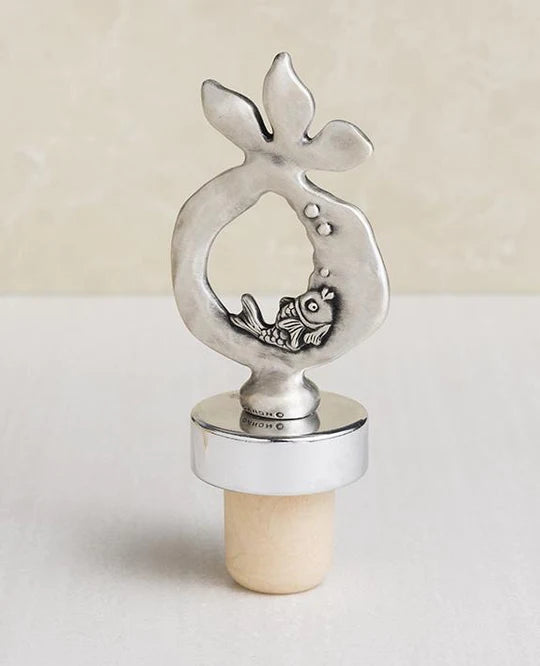 A beautiful pomegranate-shaped wine stopper, coated in silver.