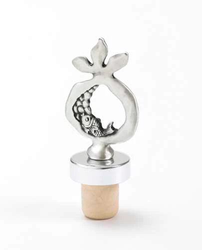 A beautiful pomegranate-shaped wine stopper, coated in silver.