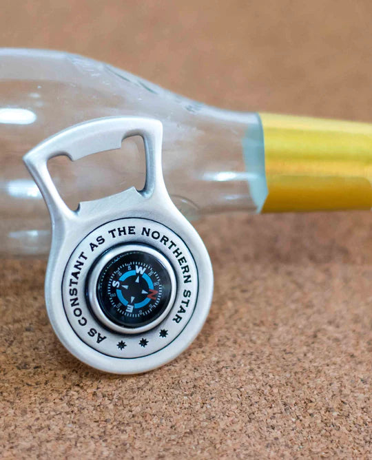 Bottle opener with a compass.