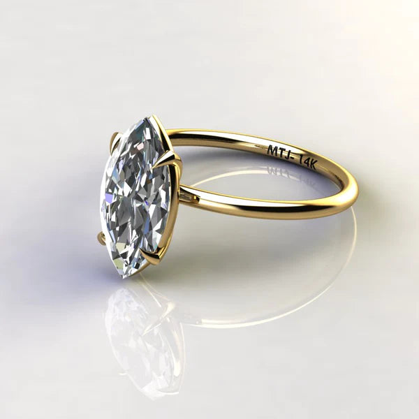 A 14K gold engagement ring with a marquise-cut stone measuring 2 carats.