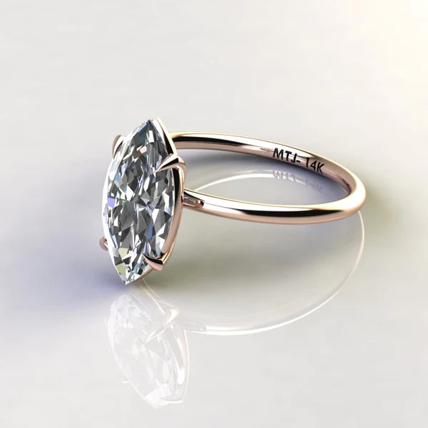 A 14K gold engagement ring with a marquise-cut stone measuring 2 carats.